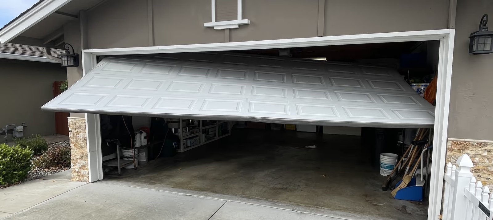Expert technician repairing garage door system