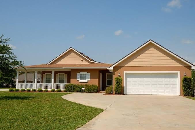 Modern luxury warm cedar garage door installation in Timberwood Park